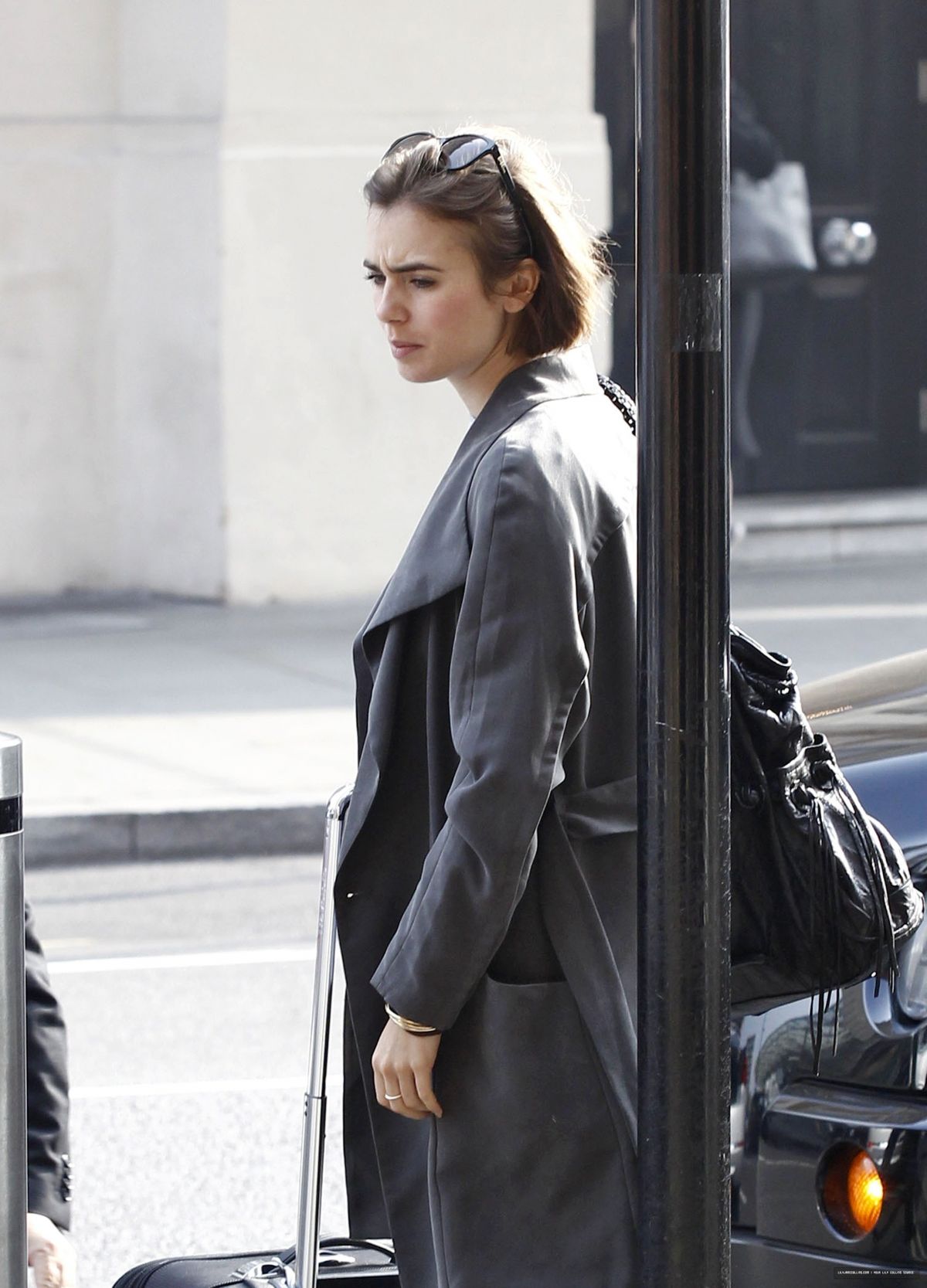 LILY COLLINS at A Railway Station in London LILY COLLINS at A Railway Station in London