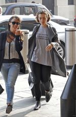 LILY COLLINS at A Railway Station in London