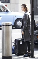 LILY COLLINS at A Railway Station in London