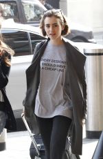 LILY COLLINS at A Railway Station in London
