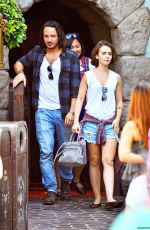 LILY COLLINS with New Boyfriend in Disneyland in Los Angeles
