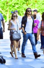LILY COLLINS with New Boyfriend in Disneyland in Los Angeles