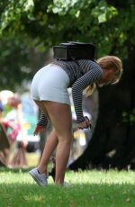 MARGOT ROBBIE in Shorts at a Park in London