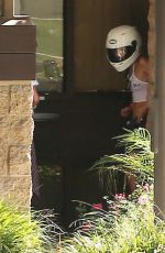 MILEY CYRUS Riding a Motorcycle Out in Beverly Hills