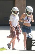 MILEY CYRUS Riding a Motorcycle Out in Beverly Hills