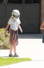 MILEY CYRUS Riding a Motorcycle Out in Beverly Hills