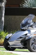 MILEY CYRUS Riding a Motorcycle Out in Beverly Hills