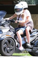 MILEY CYRUS Riding a Motorcycle Out in Beverly Hills