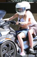 MILEY CYRUS Riding a Motorcycle Out in Beverly Hills