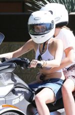 MILEY CYRUS Riding a Motorcycle Out in Beverly Hills