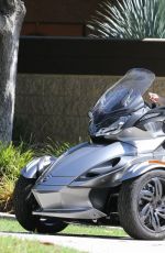 MILEY CYRUS Riding a Motorcycle Out in Beverly Hills