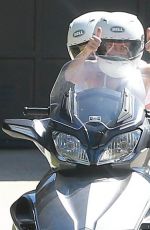 MILEY CYRUS Riding a Motorcycle Out in Beverly Hills