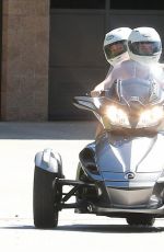 MILEY CYRUS Riding a Motorcycle Out in Beverly Hills