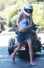 MILEY CYRUS Riding a Motorcycle Out in Beverly Hills