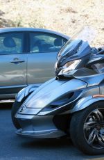 MILEY CYRUS Riding a Motorcycle Out in Beverly Hills