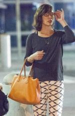 MILLA JOVOVICH Arrives at JFK Arport in New York