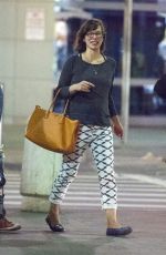 MILLA JOVOVICH Arrives at JFK Arport in New York