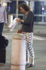 MILLA JOVOVICH Arrives at JFK Arport in New York