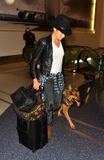 NIKKI REED and Her Dog at LAX Airport