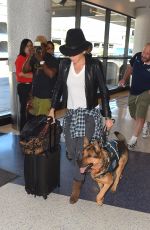 NIKKI REED and Her Dog at LAX Airport