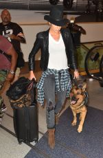 NIKKI REED and Her Dog at LAX Airport