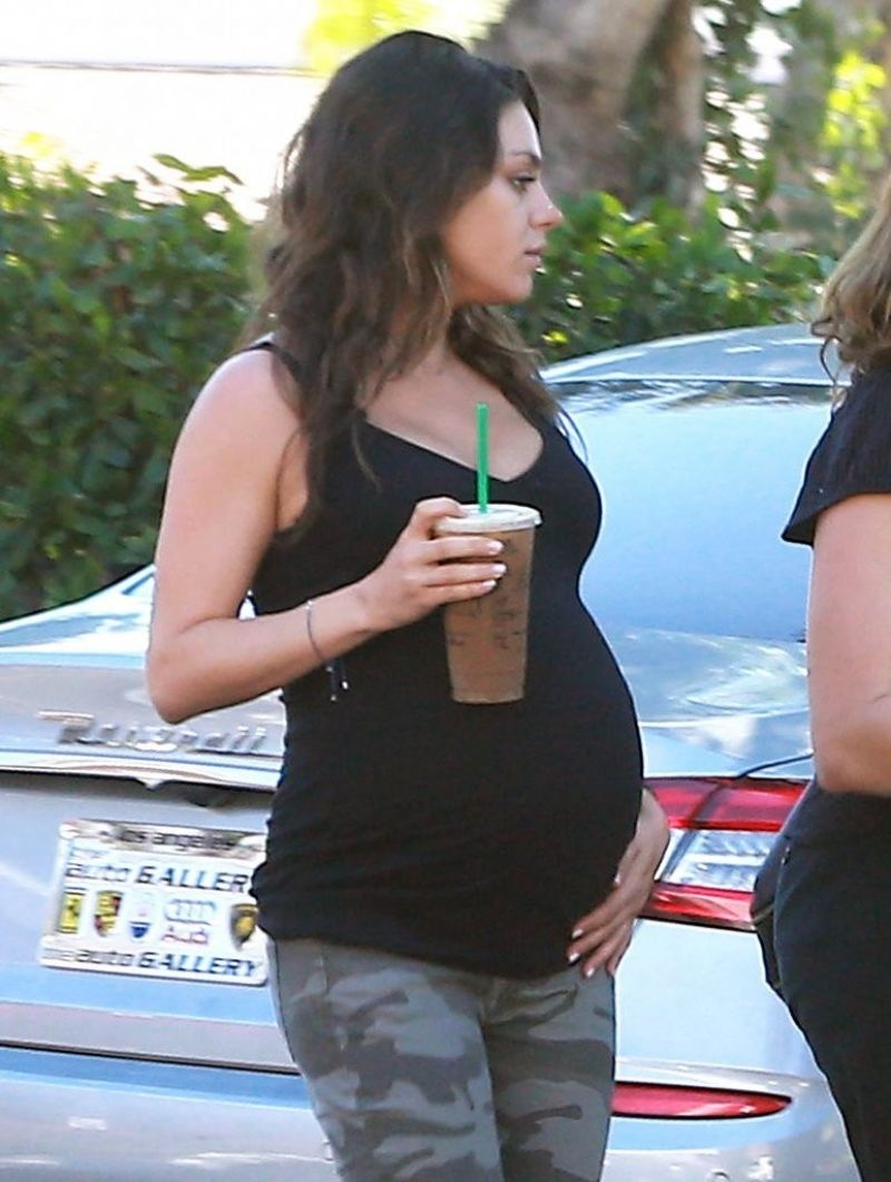 Pregnant MILA KUNIS in Tights Leaves Starbucks in Studio City Pregnant MILA KUNIS in Tights Leaves Starbucks in Studio City