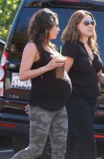 Pregnant MILA KUNIS in Tights Leaves Starbucks in Studio City
