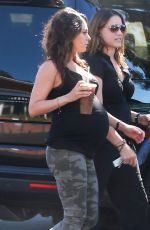 Pregnant MILA KUNIS in Tights Leaves Starbucks in Studio City
