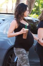 Pregnant MILA KUNIS in Tights Leaves Starbucks in Studio City