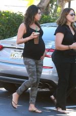 Pregnant MILA KUNIS in Tights Leaves Starbucks in Studio City