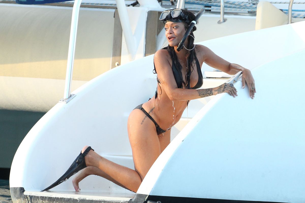 RIHANNA in Bikini at a Boat in Barbados.