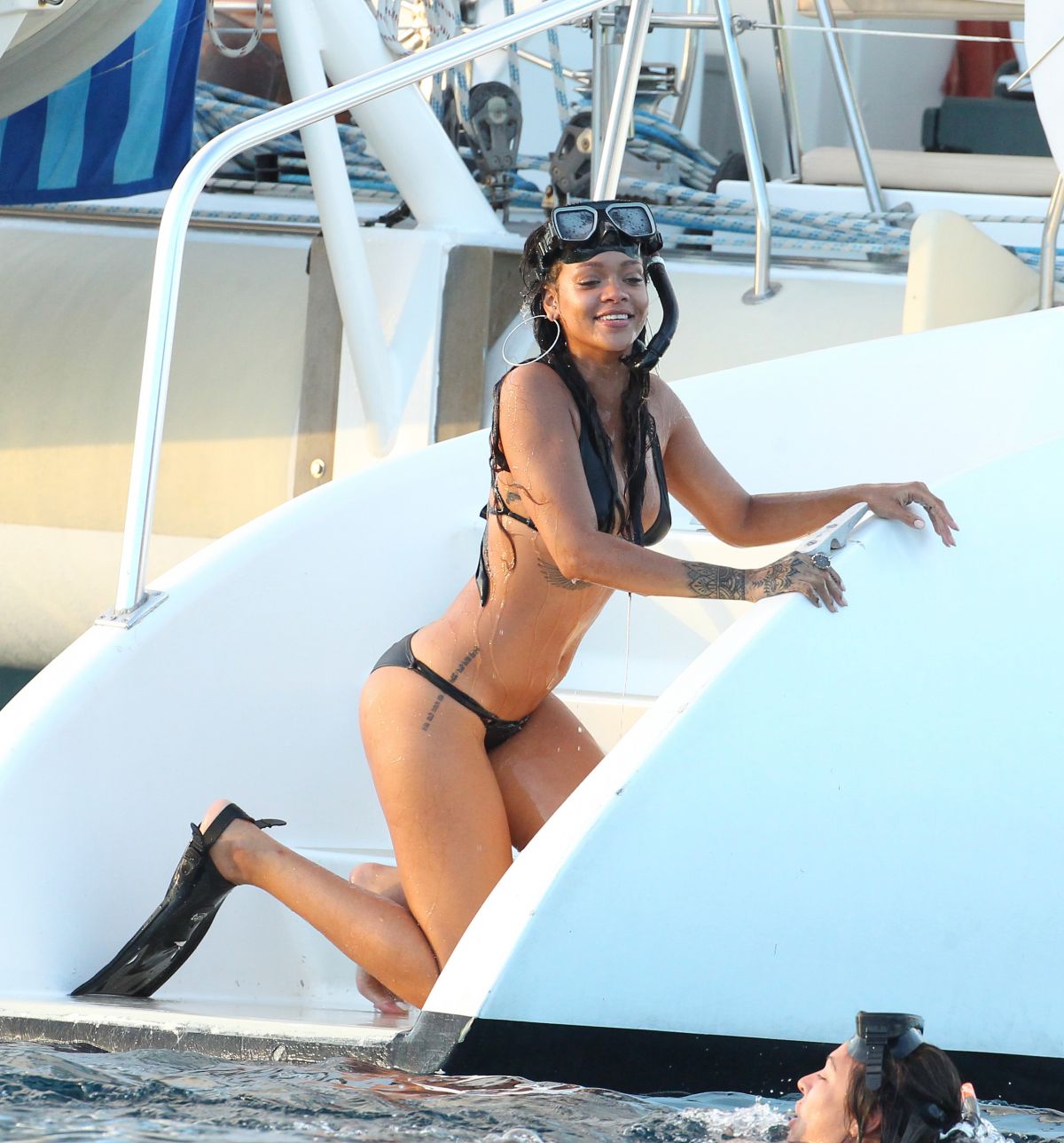 RIHANNA in Bikini at a Boat in Barbados.