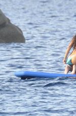 RIHANNA in Bikini Paddleboarding in Italy