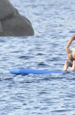 RIHANNA in Bikini Paddleboarding in Italy