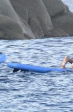 RIHANNA in Bikini Paddleboarding in Italy