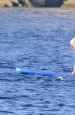 RIHANNA in Bikini Paddleboarding in Italy