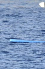 RIHANNA in Bikini Paddleboarding in Italy