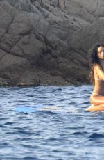 RIHANNA in Bikini Paddleboarding in Italy