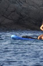 RIHANNA in Bikini Paddleboarding in Italy