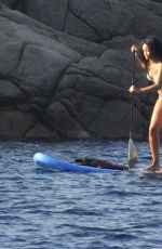 RIHANNA in Bikini Paddleboarding in Italy