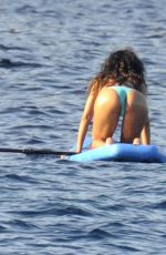 RIHANNA in Bikini Paddleboarding in Italy