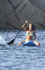 RIHANNA in Bikini Paddleboarding in Italy