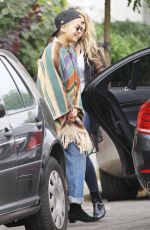 RITA ORA Wearing a Poncho Out in London