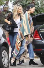 RITA ORA Wearing a Poncho Out in London