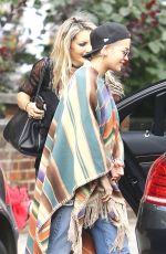 RITA ORA Wearing a Poncho Out in London