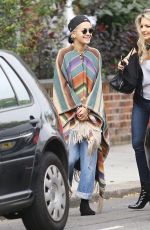 RITA ORA Wearing a Poncho Out in London