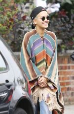 RITA ORA Wearing a Poncho Out in London