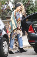RITA ORA Wearing a Poncho Out in London