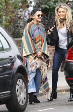 RITA ORA Wearing a Poncho Out in London