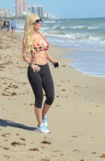 ANA BRAGA in Bikini Top Working Out at a Beach in Miami
